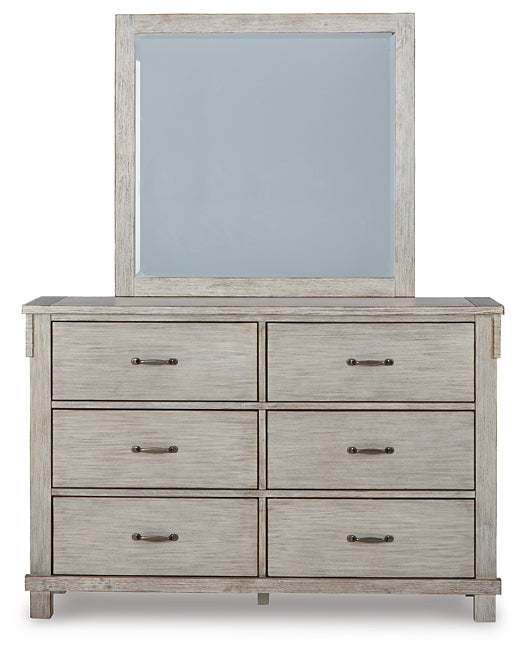 Hollentown Queen Panel Bed with Mirrored Dresser and Chest