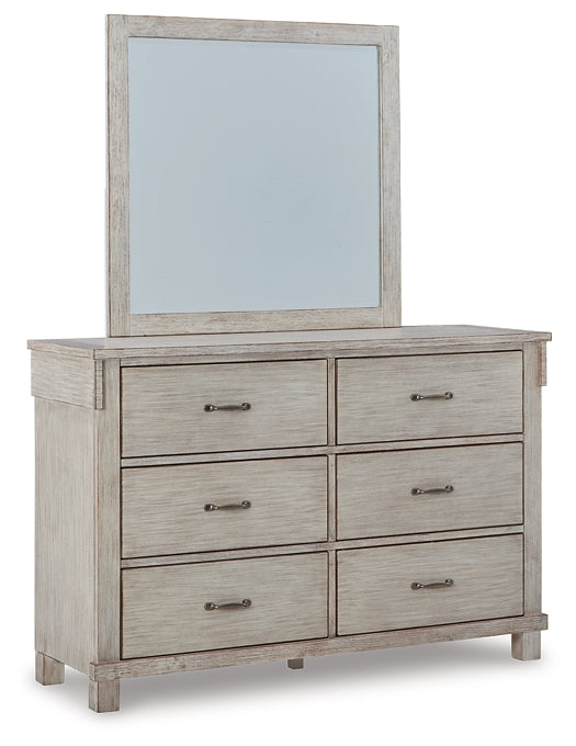 Hollentown Queen Panel Bed with Mirrored Dresser and Chest